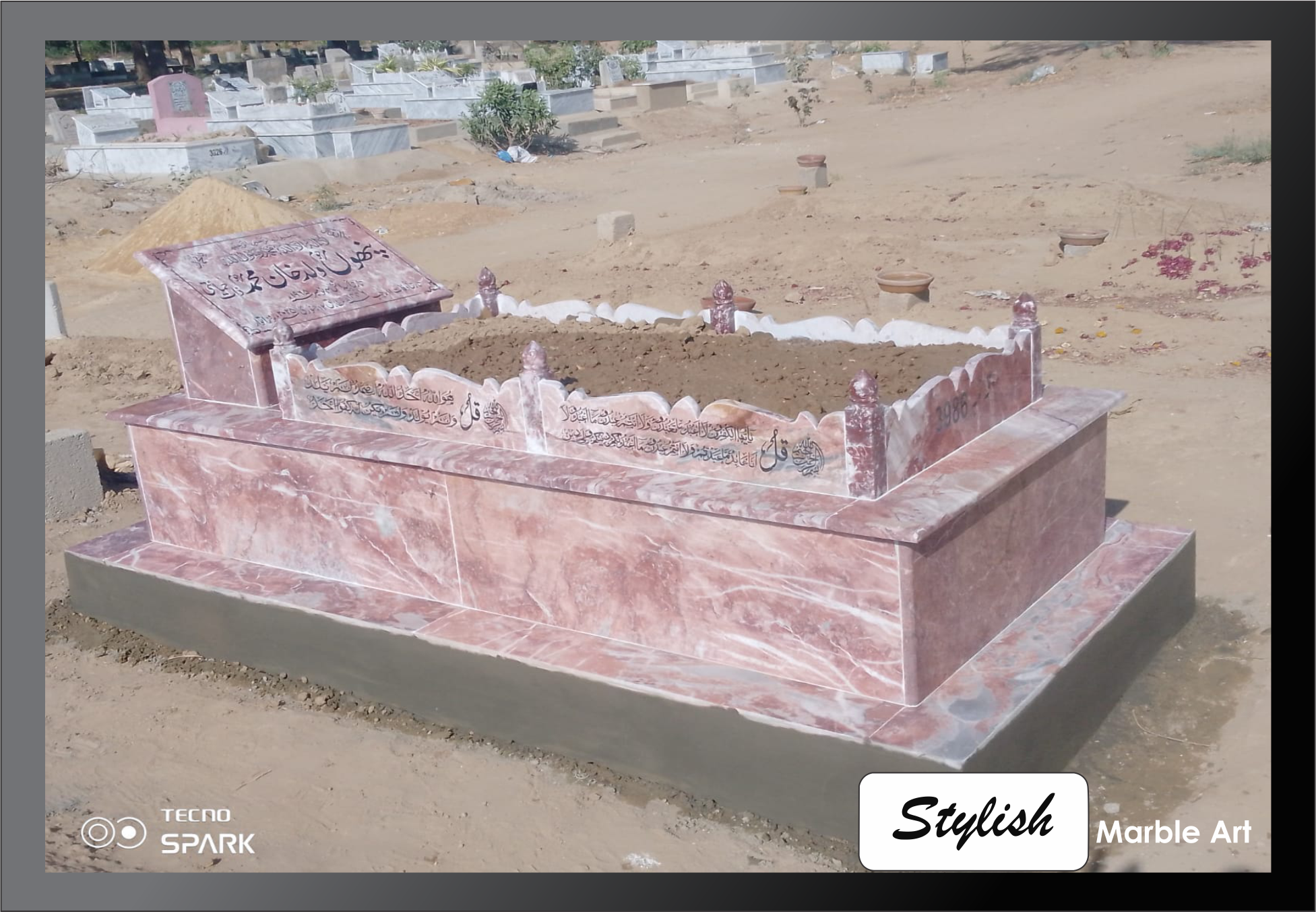 A newly completed white marble gravestone.